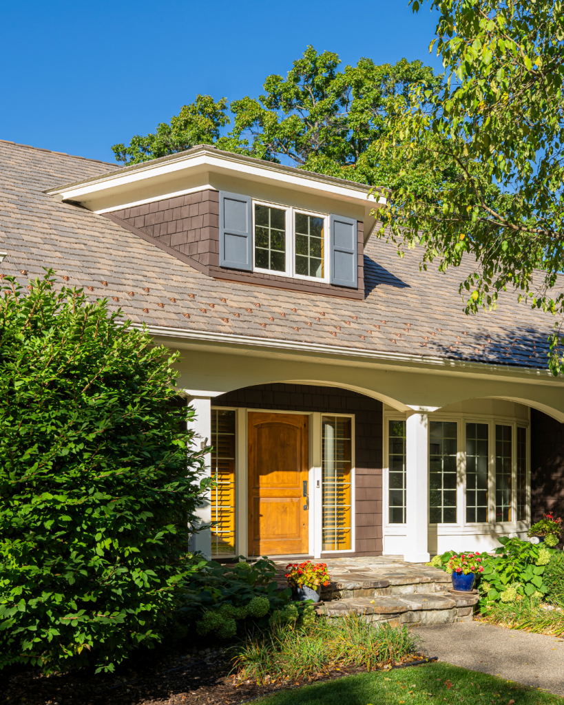 Front entryway of a remodeled home featuring a low-maintenance composite roof that helped lower the homeowner’s insurance premium.