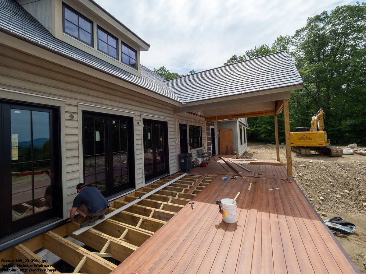 backyard view of The House That Blues Built with installed Province Slate roof.