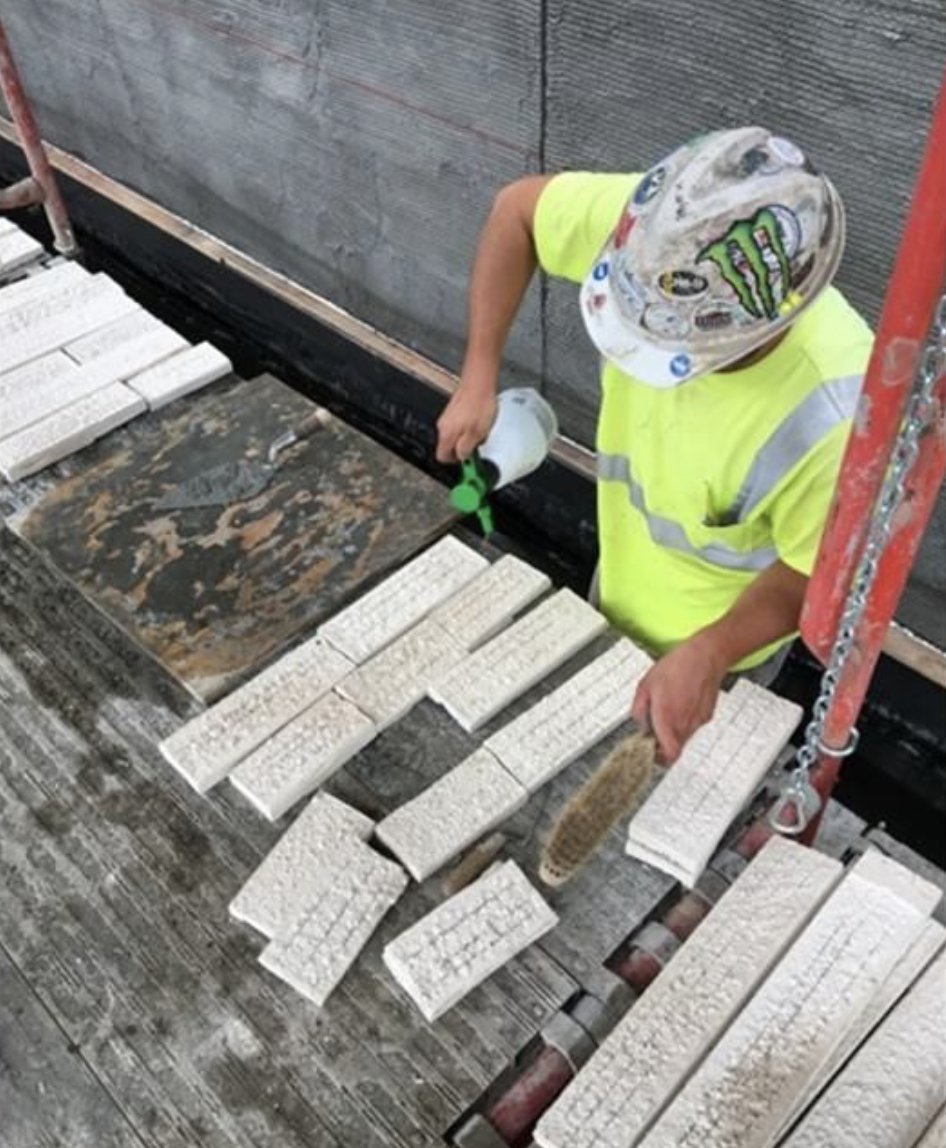 A best practice for achieving bond is to hydrate both your cured scratch coat and the bondable surface on the back of the stone veneer.