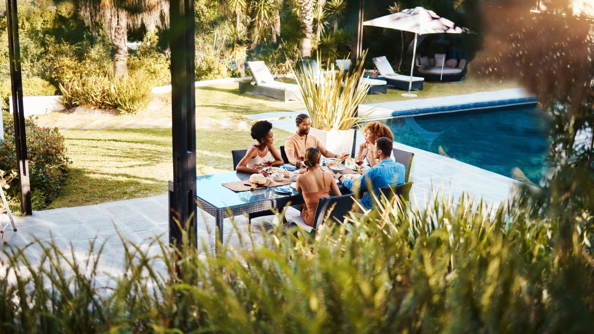 Friends eating dinner outside together