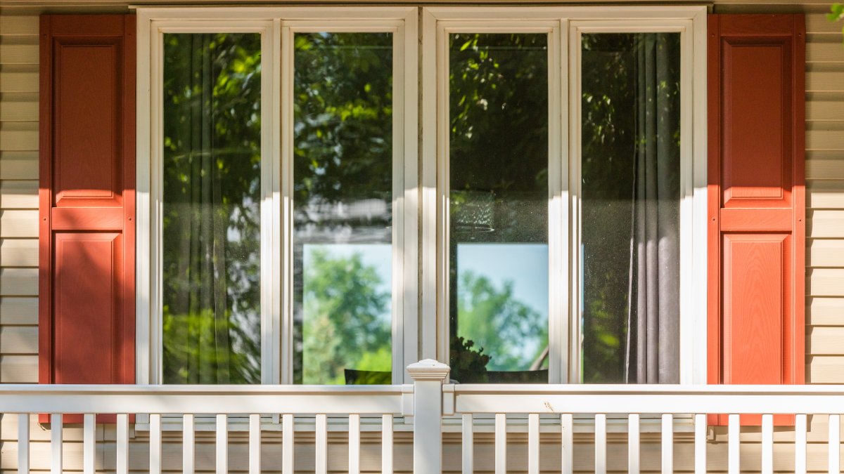 Windows with red shutters
