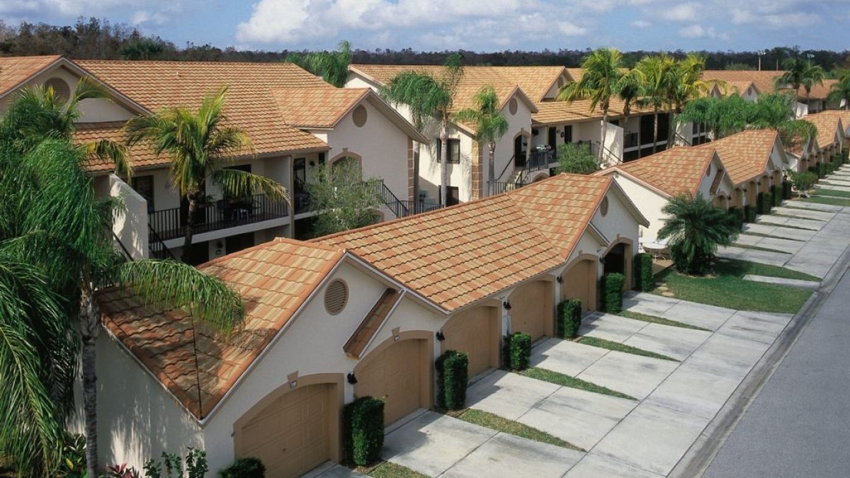Unified Steel Barrel Vault roofing in Sunset Gold on a condominium complex and garages 