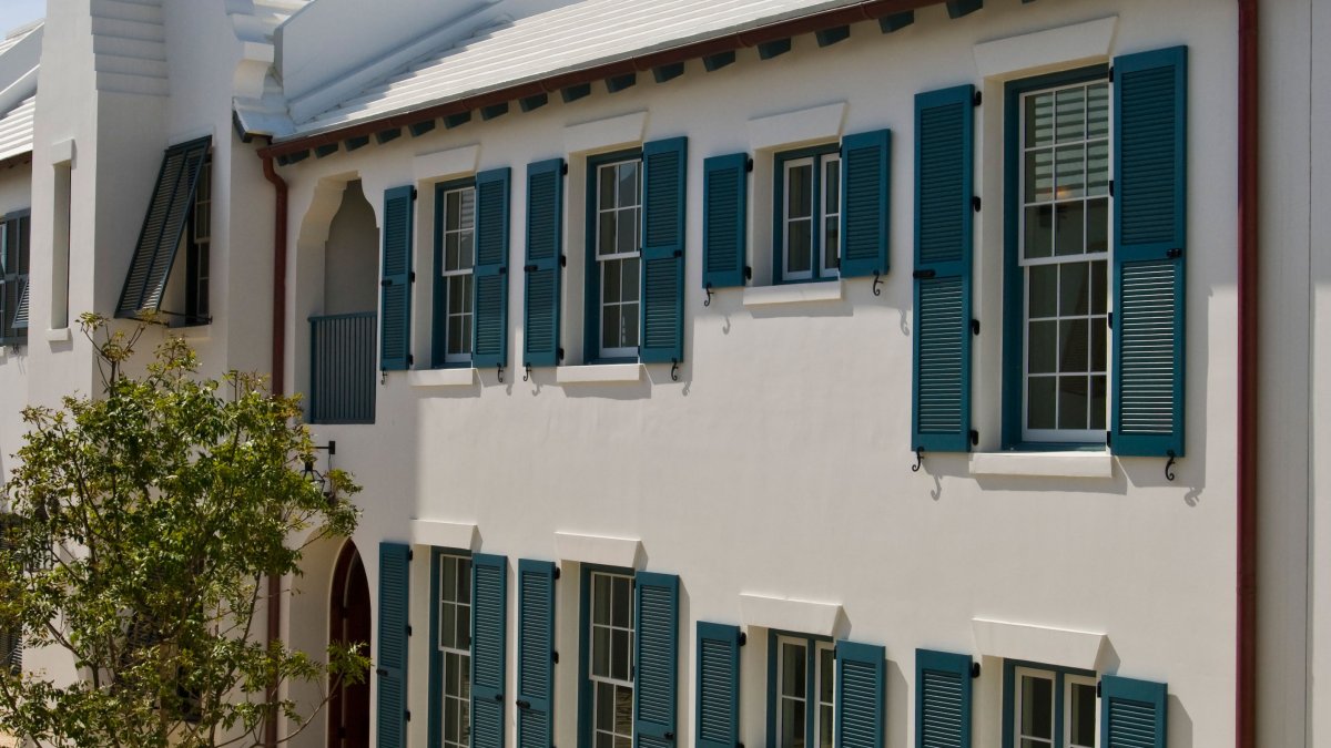 Blue Atlantic Premium Shutters on white beach house