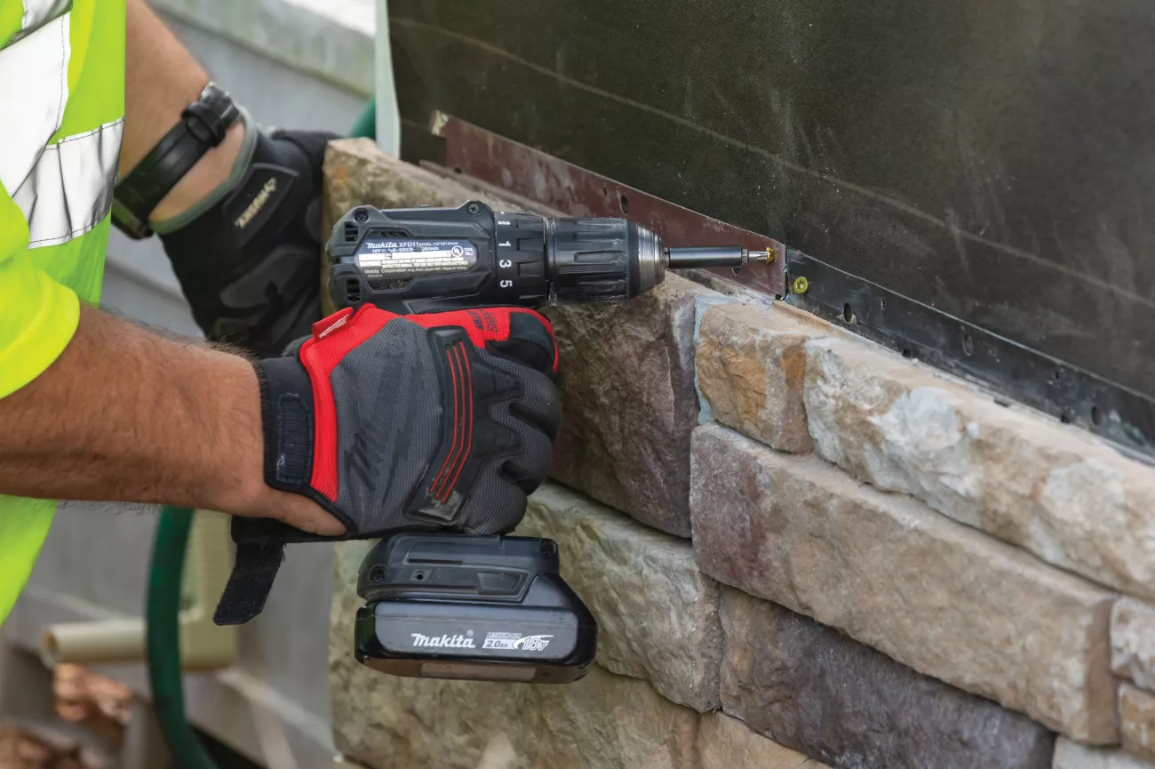 Contractor installing Versetta Stone